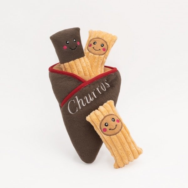 ZippyPaws Zippy Burrows Churro Cone Vers uit de Zippy keuken zijn deze heerlijke Churro's, in de smaken kaas, vegetarisch en pepperoni. De ZippyPaws Zippy Burrows Churro Cone is een geweldig  verstop-spelletje om samen met jouw hond te spelen. De 3 piepende pluche churro's moeten uit de puntzak worden gehaald. De ZippyPaws Zippy Burrows Churro Cone houdt je hond lekker bezig, voorkomt verveling en bevordert mentale stimulatie. Formaat: 16 x 15 Let op: Er is geen enkel hondenspeelgoed in de wereld wat niet kapot kan. Ondanks de algehele stevigheid van het speelgoed, zou het kapot kunnen gaan. Op hondenspeelgoed zit geen garantie. Kies dus het juiste soort speeltje voor jouw hond zijn kauw- en speelbehoefte. Haal kapotte speeltjes meteen weg en laat jouw hond alleen spelen onder toezicht. ZippyPaws Hondenspeelgoed Hondenspeeltjes van het merk ZippyPaws staan garant voor de allerleukste designs en zijn goed voor urenlang speelplezier. De hondenspeeltjes van ZippyPaws zijn ontworpen door hondenmensen voor honden. En dat zie je aan alles. ZippyPaws Burrows De Zippypaws Burrows zijn zoekspellen voor de hond. In iedere Burrow zitten 3 piepbeestjes verstopt. Speciaal voor honden die niet enthousiast worden van hersenwerkjes met voer zijn de Burrows perfect. Want de beloning is geen voer, maar een klein piepspeeltje. Je kunt de speeltjes zo vaak terug stoppen als je wilt, zodat jouw hond weer op zoek kan! Alle delen van de Zippy Burrows zijn gemaakt van hoogwaardig pluche stof. Daardoor is het niet alleen geschikt als interactief speeltje, maar kan het ook gebruikt worden als knuffelspeeltje. Alle speeltjes in de Burrows bevatten een ronde pieper om je hond extra enthousiast te maken. Interactief hondenspeelgoed bestellen Alle honden hebben speelgoed nodig. Het geeft zowel een mentale- als lichamelijke uitdaging voor je hond! Interactief hondenspeelgoed is niet alleen belangrijk om je hond tevreden te houden en verveling te voorkomen. Het is ook nuttig om problematisch gedrag aan te pakken, zoals destructief kauwen of hinderlijk blaffen. Zippypaws Burrows De Zippypaws Burrows zijn zoekspellen voor de hond. In iedere Burrow zitten 3 piepbeestjes verstopt. Speciaal voor honden die niet enthousiast worden van hersenwerkjes met voer zijn de Burrows perfect. Want de beloning is geen voer, maar een klein piepspeeltje. Je kunt de speeltjes zo vaak terug stoppen als je wilt, zodat jouw hond weer op zoek kan! Alle delen van de Zippy Burrows zijn gemaakt van hoogwaardig pluche stof. Alle speeltjes in de Burrows bevatten een ronde pieper om je hond extra enthousiast te maken. Doordat zowel de Burrow als de speeltjes in de Burrow van pluche zijn gemaakt is het niet alleen geschikt als interactiefspeeltje, maar kan het ook gebruikt worden als knuffelspeeltje. ZippyPaws Donutz Het populairste speeltje van Zippypaws is de Donut. Al in 2017 werd de miljardste donut verkocht. Voor de hond zijn de donut speeltjes helemaal geweldig. Er zitten 2 half ronde piepers in, waardoor het niet uitmaakt waar je in de donut bijt. Piepen doet de Zippypaws Donut altijd! De Donutz bevatten verder geen zachte pluche vulling. Ideaal voor honden die het normaal altijd laten sneeuwen in huis. Bekend van Instagram Als jij honden volgt via Instagram, dan kan het niet missen dat je de ZippyPaws hondenspeeltjes wel eens voorbij hebt zien komen. Niet zo gek want de grappige en interactieve speeltjes zijn perfect voor een geweldige foto samen met jouw hond. Vergeet je A Lot for Doodles niet te taggen op Instagram? ZippyPaws Nederland ZippyPaws hondenspeelgoed komt uit Amerika. Sinds een aantal jaren zijn de speeltjes ook in Nederland verkrijgbaar. Wij van A Lot for Doodles zijn trots dat we ZippyPaws verkopen in onze webshop. Bezoek onze shop en ontdek alle leuke speeltjes van ZippyPaws! ZippyPaws online bestellen De ZippyPaws hondenspeeltjes zijn bij ons online te bestellen. Naast de leuke speeltjes van ZippyPaws kun je ook bij ons terecht voor de merken Huxley & Kent, PawStory, HugSmart, Sodapup, Soos Pets, Cowboy Magic, Bass Brushes, P.L.A.Y., Yakka's & Carniwell. Heb je advies nodig? Neem gerust contact met ons op. We helpen je graag!