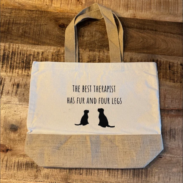 A Lot for Doodles Jute Tas The Best Therapist - Stijlvol en Praktisch voor Elke Hondenliefhebber Laat jouw liefde voor je hond zien met de A Lot for Doodles Jute Tas The Best Therapist! Deze stevige en duurzame tas heeft een inhoud van 18 liter, perfect voor al je boodschappen, hondenspeeltjes, of dagelijkse benodigdheden. De A Lot for Doodles Jute Tas The Best Therapist is bedrukt met de  tekst: "The Best Therapist Has Fur and Four Legs", wat hem niet alleen praktisch maakt, maar ook een echte eyecatcher voor hondenliefhebbers. Shop A Lot for Doodles Jute Tas The Best Therapist Ruim en praktisch: Met een inhoud van 18 liter is deze tas ideaal voor dagelijks gebruik, van boodschappen tot wandelspullen voor je hond. Duurzaam en milieuvriendelijk: Gemaakt van hoogwaardige jute, perfect voor wie op zoek is naar een duurzame keuze. Uniek design: Een stijlvolle manier om je liefde voor honden te tonen en een glimlach te brengen op het gezicht van andere hondenfans. De A Lot for Doodles Jute Tas The Best Therapist is niet alleen handig, maar ook het perfecte cadeau voor elke hondenliefhebber. Bestel de A Lot for Doodles Jute Tas "The Best Therapist" vandaag nog en maak elke dag een beetje vrolijker! A Lot for Doodles - Jouw Bestemming voor Hondenspeelgoed en Accessoires! A Lot for Doodles is dé webshop voor alles wat jouw hond gelukkig maakt! Of je nu op zoek bent naar hoogwaardig hondenspeelgoed, handige accessoires of smakelijke snacks, wij hebben het allemaal. Wij zijn trots om een breed scala aan producten aan te bieden van toonaangevende merken zoals Bass Brushes, Cowboy Magic en Nocat Studio, evenals populaire namen als ZippyPaws, HugSmart, PawStory, Sodapup, en vele anderen. Ons Assortiment Hondenspeelgoed- Laat je viervoeter genieten van onze uitgebreide collectie hondenspeelgoed. Van interactieve speeltjes van ZippyPaws en SodaPup tot schattige knuffels van HugSmart en PawStory, er is voor elke hond iets te vinden. Elk speeltje is ontworpen om het spelplezier en de mentale uitdaging te bevorderen, zodat je hond actief en gelukkig blijft. Gezonde Hypoallergene HondenSnacks - Verwen je hond met onze smakelijke Carniwell snacks en Yakka's. Deze gezonde lekkernijen zijn perfect voor training of gewoon als tussendoortje. Met hoogwaardige ingrediënten zorgen we ervoor dat jouw hond de beste voeding krijgt, zonder concessies te doen aan de smaak. Alle snacks zijn Hypoallergeen en zowel graan- als glutenvrij!. Verzorging en Accessoires- Naast speelgoed en snacks bieden we ook praktische accessoires aan, zoals Bass borstels voor een perfecte vachtverzorging, verstelbare hondenlijnen voor extra comfort en controle, en trendy bandana's om jouw hond in stijl te laten verschijnen. Onze voerbakken zijn zowel functioneel als stijlvol, waardoor ze een geweldige aanvulling zijn op elke hondenruimte. Waarom Kiezen voor A Lot for Doodles? Groot Assortiment: Een uitgebreide selectie van speelgoed, snacks en accessoires voor elke hond. Topmerken: Wij zijn dealer van bekende merken, zodat je alleen de beste producten koopt. Klantenservice: Ons vriendelijke team staat klaar om je te helpen bij het vinden van de perfecte producten voor jouw hond. A Happy Dog is A Happy Life Bij ‘A Lot for Doodles’ vind jij alles wat jouw hond gelukkig maakt! De webshop voor leuk en interactief speelgoed, snacks, verzorgingsproducten en veel meer! Wij hopen jou en je hond elke keer weer te verrassen. Want zeg nou eerlijk, ‘A happy dog is a happy life!’ Bestel Vandaag Nog! Bezoek onze webshop en ontdek alles wat A Lot for Doodles te bieden heeft. Maak van elke dag een feestje voor jouw hond met ons hoogwaardige assortiment. Bestel vandaag nog en geef je viervoeter de liefde en aandacht die hij verdient! Volg A Lot for Doodles op Instagram Blijf altijd op de hoogte van de leukste producten voor jouw hond. Volg ons op Instagram en Facebook.